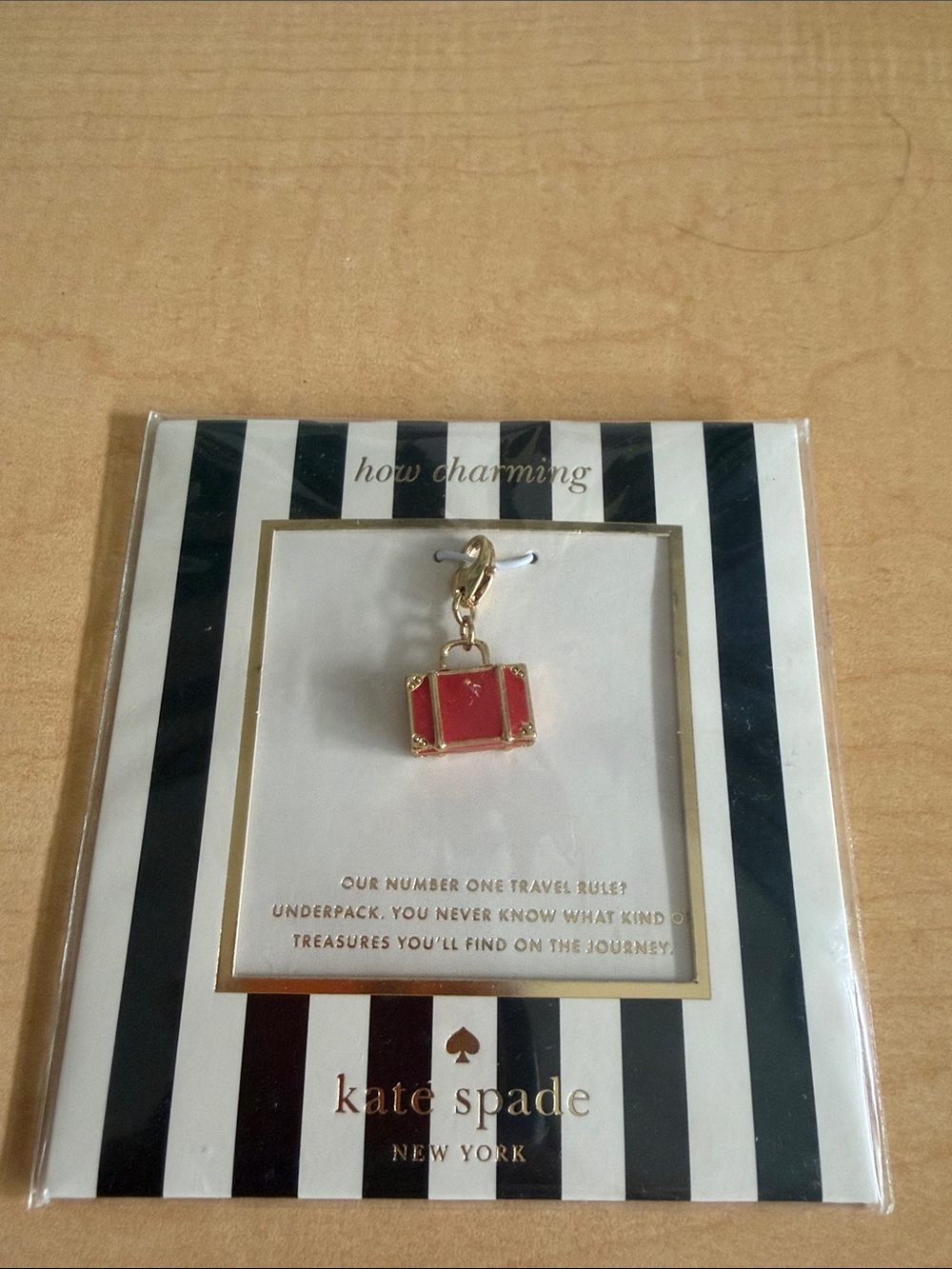 kate spade red and gold suitcase charm